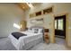 Well-lit main bedroom featuring a skylight and views from the windows at 2191 Baldy Ln, Evergreen, CO 80439