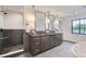 Spacious bathroom with dual vanities, stand alone shower and modern finishes providing luxury and functionality at 3019 Chase St, Wheat Ridge, CO 80214
