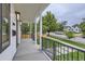 View of the front porch that overlooks the street, complemented by well-maintained landscaping at 3019 Chase St, Wheat Ridge, CO 80214