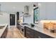 Modern kitchen featuring stainless steel appliances, sleek countertops, and ample storage space at 3019 Chase St, Wheat Ridge, CO 80214