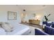 Sunlit main bedroom with vaulted ceiling, light wood floors, and stylish decor creates a serene and comfortable retreat at 3019 Chase St, Wheat Ridge, CO 80214