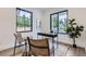 Bright home office with large windows offering natural light and a view of the neighborhood, completed with modern decor at 3019 Chase St, Wheat Ridge, CO 80214