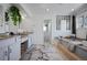 Bright bathroom with double vanity, granite countertops, and soaking tub at 4505 S Yosemite St # 433, Denver, CO 80237
