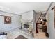 Stone fireplace between a living area and the primary bedroom at 4505 S Yosemite St # 433, Denver, CO 80237