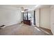 Bright and airy bedroom with large window, dresser, and neutral colored carpet at 4505 S Yosemite St # 433, Denver, CO 80237