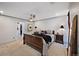 Comfortable bedroom features a ceiling fan and neutral carpeting at 4505 S Yosemite St # 433, Denver, CO 80237