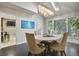 A dining room filled with natural light, a chandelier, and seating for four at 4505 S Yosemite St # 433, Denver, CO 80237