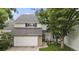 Charming two-story home with a well-maintained lawn, stone accents, and a two-car garage at 4505 S Yosemite St # 433, Denver, CO 80237