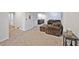 Inviting living room with plush sofa, accent table, and carpeting at 4505 S Yosemite St # 433, Denver, CO 80237