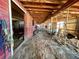 Rustic barn interior with multiple stalls and exposed wooden beams at 1740 Michael Gates Dr, Parker, CO 80138