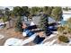 Aerial view of house and driveway, surrounded by trees at 1740 Michael Gates Dr, Parker, CO 80138