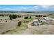 Aerial view of grassy property featuring horse stables and plenty of space at 1740 Michael Gates Dr, Parker, CO 80138