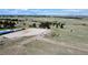 Extensive property showcases a well-maintained horse training area and a herd of grazing livestock at 1740 Michael Gates Dr, Parker, CO 80138