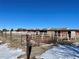 Exterior view of barn with multiple stalls and snow at 1740 Michael Gates Dr, Parker, CO 80138