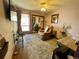 Cozy bedroom featuring plush carpeting, a recliner, and a sliding mirror closet at 1740 Michael Gates Dr, Parker, CO 80138