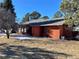 Side view featuring exterior of home with brick chimney and views from multiple windows at 1740 Michael Gates Dr, Parker, CO 80138