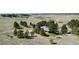 Secluded red home surrounded by mature trees on a large lot at 1740 Michael Gates Dr, Parker, CO 80138