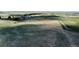 Expansive land showing rolling terrain with a dirt road and scattered trees and buildings at 1740 Michael Gates Dr, Parker, CO 80138