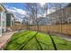 Fenced back yard with a manicured lawn and mature trees, creating a private outdoor space at 2889 Windridge Cir, Highlands Ranch, CO 80126