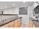 Basement bar area with sink, mini refrigerator, stone counter tops, and storage at 2889 Windridge Cir, Highlands Ranch, CO 80126