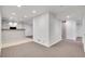 Finished basement with carpet, lights, and sliding wooden door at 2889 Windridge Cir, Highlands Ranch, CO 80126