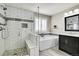 Beautiful bathroom featuring a walk-in shower, soaking tub, and modern finishes at 2889 Windridge Cir, Highlands Ranch, CO 80126