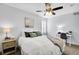 Cozy bedroom featuring soft lighting and a plush bed with decorative pillows at 2889 Windridge Cir, Highlands Ranch, CO 80126