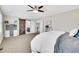 Inviting bedroom featuring a decorative sliding barn door that leads to the ensuite bathroom at 2889 Windridge Cir, Highlands Ranch, CO 80126