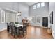 Bright dining room with high ceilings, hardwood floors, large windows, and elegant chandelier at 2889 Windridge Cir, Highlands Ranch, CO 80126