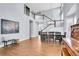 Bright dining room with high ceilings, hardwood floors, large windows, staircase and elegant chandelier at 2889 Windridge Cir, Highlands Ranch, CO 80126