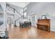 Spacious dining room with high ceilings, hardwood floors, large windows, staircase and elegant chandelier at 2889 Windridge Cir, Highlands Ranch, CO 80126