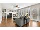 Cozy living room with fireplace, hardwood floors, comfortable seating, ceiling fan, and ample natural light at 2889 Windridge Cir, Highlands Ranch, CO 80126