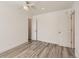 Neutral bedroom with wood look flooring and ceiling fan at 8322 S Upham Way, Littleton, CO 80128