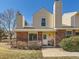Charming two-story home with brick and vinyl siding at 8322 S Upham Way, Littleton, CO 80128
