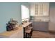 Charming kitchen with white and gray cabinets, granite countertops, and stainless appliances at 8322 S Upham Way, Littleton, CO 80128