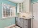 Bright kitchen featuring shaker cabinets, granite countertops, and stainless steel appliances at 8322 S Upham Way, Littleton, CO 80128