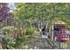 Private backyard with brick pavers, bench seating, and a fenced perimeter at 1450 Albion St # 206, Denver, CO 80220