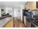 This kitchen features stainless appliances, modern cabinets, and an open-concept layout at 1450 Albion St # 206, Denver, CO 80220