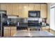 The kitchen has stainless appliances, granite countertops, and plenty of cabinet space at 1450 Albion St # 206, Denver, CO 80220