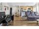 Open concept living space features hardwood floors, a modern kitchen and living room at 1450 Albion St # 206, Denver, CO 80220