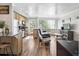 Living space boasts hardwood floors, a modern kitchen, and bright natural light from big windows at 1450 Albion St # 206, Denver, CO 80220