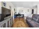 The living room boasts hardwood floors, a neutral color palette, and bright natural light at 1450 Albion St # 206, Denver, CO 80220