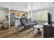 Bright living space showcases hardwood floors, neutral paint, and views from the large window at 1450 Albion St # 206, Denver, CO 80220