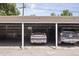 Assigned parking spot in the covered parking area with brick walls and ample space at 1450 Albion St # 206, Denver, CO 80220