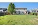 Expansive backyard with lush green grass and a charming two-story home, perfect for outdoor enjoyment at 1121 W Kettle Ave, Littleton, CO 80120