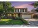 Charming two-story brick home with well-manicured lawn and inviting curb appeal at 1121 W Kettle Ave, Littleton, CO 80120