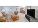Spacious living room with a neutral palette, comfortable seating, and dining area access at 1121 W Kettle Ave, Littleton, CO 80120