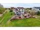 Expansive backyard featuring lush landscaping, a fire pit, and a deck at 42225 Kingsmill Cir, Elizabeth, CO 80107