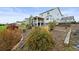 Backyard featuring mature landscaping, gravel beds, and a view of the home at 42225 Kingsmill Cir, Elizabeth, CO 80107
