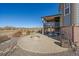 Outdoor patio featuring a fire pit, seating area, and a view of the surrounding landscape at 42225 Kingsmill Cir, Elizabeth, CO 80107